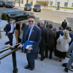 On-the-steps-at-the-White-House-complex-wearing-a-suit-and-tie